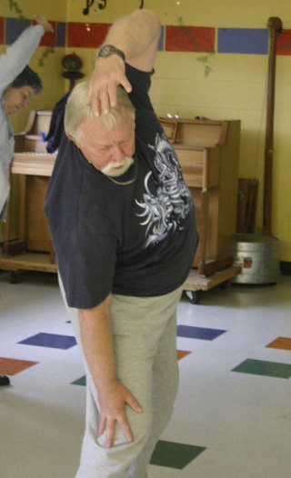 Dan Jordan takes a slow stretch during a class in tai chi at the Bayview Senior Center. Island County Senior Services is exploring the possibility of leasing space in the next year or two at the Primary School to accommodate more senior programs.