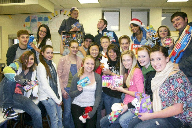 South Whidbey High School students from Sharyl Harless’s leadership class take a break from gathering gifts during third period. Students