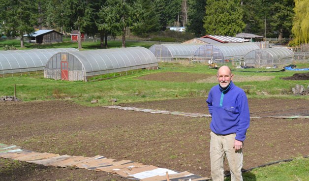 Bill McInvaille stands in front of his nearly 3 acre farm