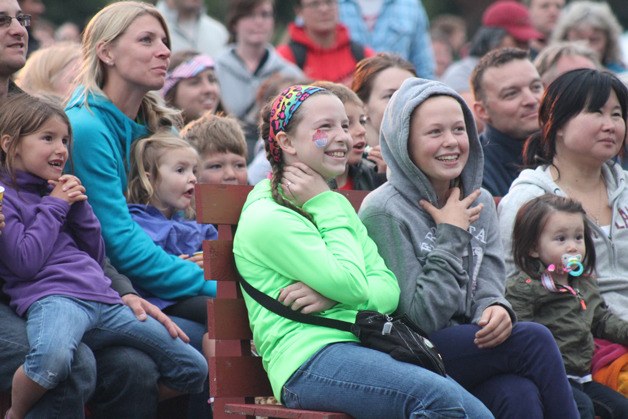 A host of people enjoy the comedy of an entertainer during the 2014 Celebrate America in Freeland.