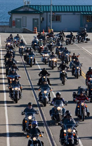 Bikers leave the Clinton ferry on their way to Anacortes on Sunday for the annual Oyster Run.