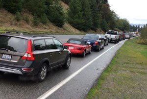 Motorists sit waiting for the ferry in Clinton on Tuesday. Waits were consistently more than two hours long this week due to a ferry shuffle in the system.