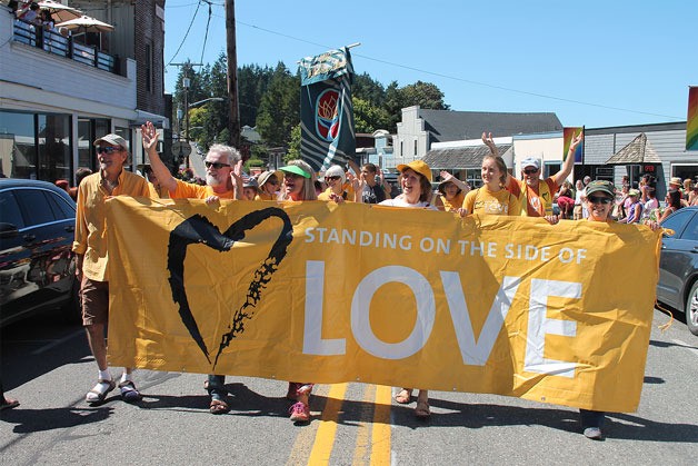 Members of the Unitarian Universalist Congregation of Whidbey Island march in the 2016 Whidbey Queer Pride Parade.