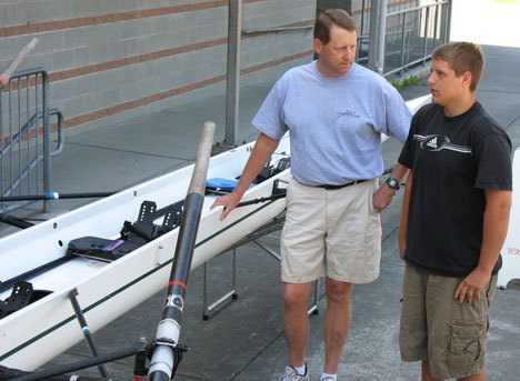 Island Rowing Association  president Carl Fjelsted and Kenny George check out the group’s newest four-man scull recently at South Whidbey High School.