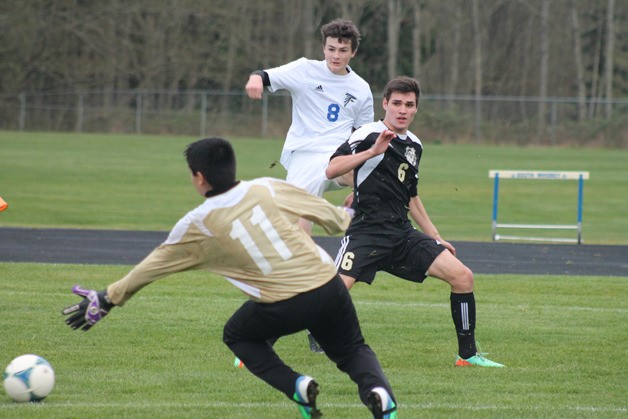 Falcon junior Kai da Rosa watches his shot roll past the reach of Lakewood goalkeeper Rodrigo Garcia on Friday