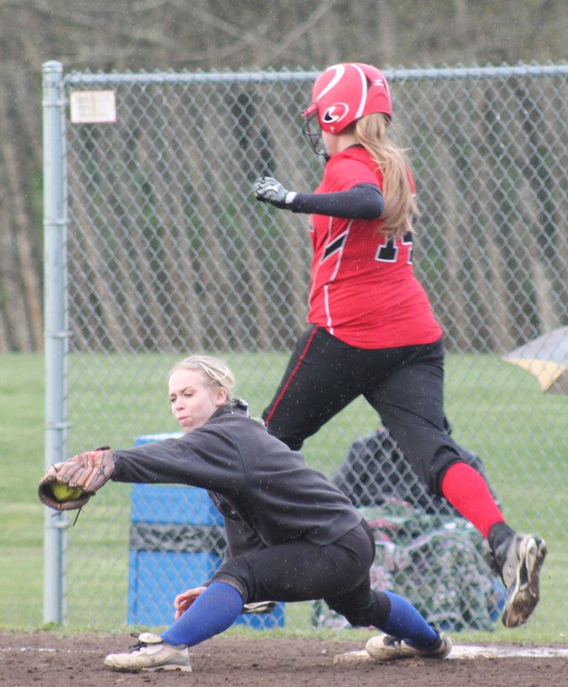 Falcon first baseman Chantel Brown stretches for the ball but the throw was late and the Coupeville batter was safe in the seventh inning.