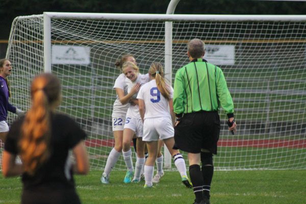 South Whidbey senior Zoe Tapert is hugged by her teammates after scoring a goal against Cedarcrest on Senior Night on Oct. 19. The score capped a wild few days for the fourth-year player