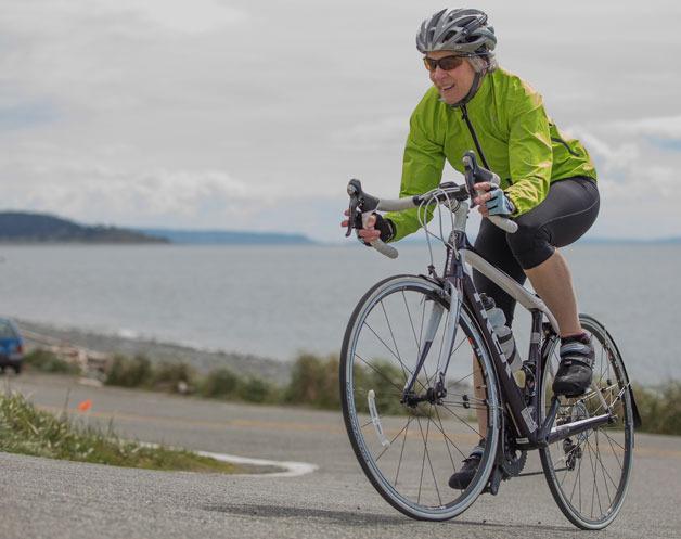 Diane Mattens bikes near Ebey’s Landing in April this year. The 55-year-old Freeland woman ride across the country from Maine to Seattle as part of the Bike the US for MS awareness and fundraising trek. The 4