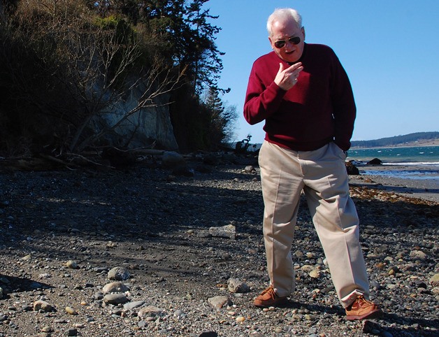 Port of Coupeville Executive Director Jim Patton walks along the beach near where human remains were discovered by a pair of pre-med students this past Friday. A state specialist is expected to examine the remains this week to determine if they are Native American in origin.