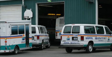 Two Island Transit vehicles await servicing in the system's only two maintenance bays in Coupeville. Island Transit is asking voters to approve an increase to the retail sales tax on Aug. 18