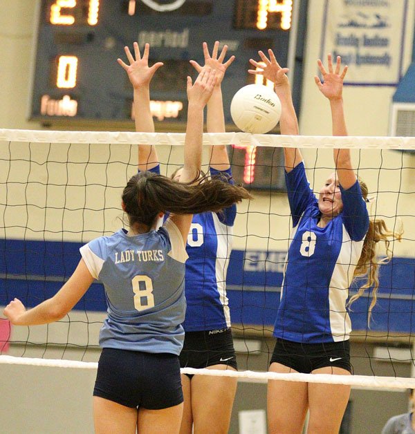 South Whidbey's Kolby Heggenes and Megan Drake combine to block an attempted kill by a Sultan player. The Falcons swept the Turks