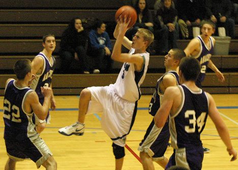 Falcon Riley Newman gets another two points during South Whidbey’s narrow 84-81 loss to the Anacortes Seahawks on Wednesday