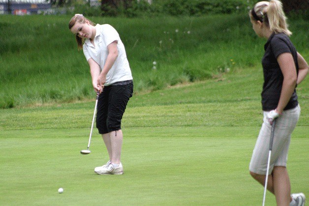 Jenna Kaik eyes her putt on the ninth hole during the 2A state girls golf tournament at the Lake Spanaway Golf Course.