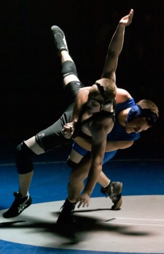 Falcon junior varsity wrestler Daniel Childers attempts a takedown Wednesday against a Cedarcrest opponent.