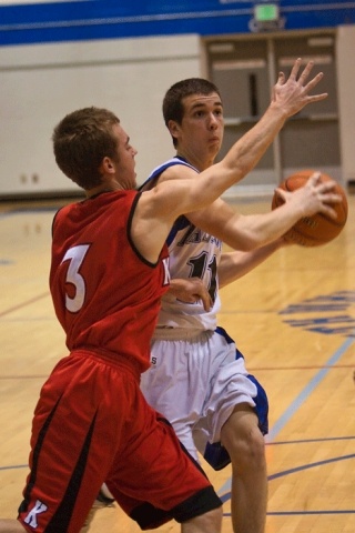 Falcon Chris Carey prepares to pass the ball to teammate Scott Stallman; a second later