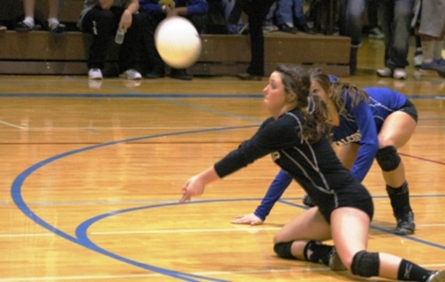 Falcon senior defensive specialist Justina Mackie-Timmermann dives for a dig against Archbishop Murphy on Tuesday night. She finished with 11 digs and two aces in a 3-1 loss to the Wildcats.