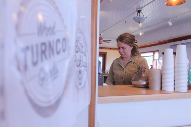 Janae Cameron tinkers with the drip coffee machine at Make Whidbey during a work day to prepare the Clinton shop for its opening this weekend