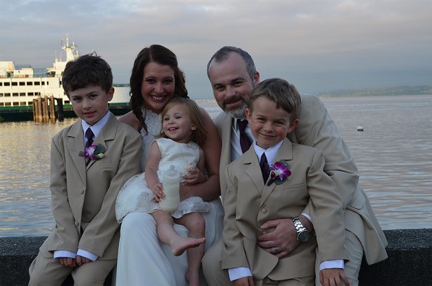 Tristan Johnson (back right) sits surrounded by his children