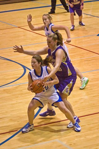 Falcon Reilly O’Sullivan defends the ball against Friday Harbor’s Mandy  Turnbull during Saturday’s 50-37 win over the Wolverines.