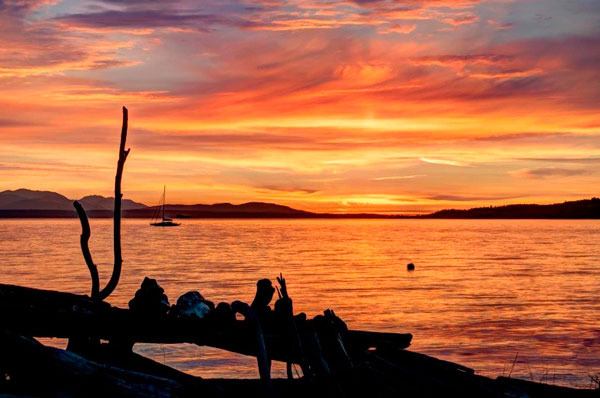 A sailboat sits off the beach in the Maxwelton area of South Whidbey Island. This is an example of the type of photo sought for the Whidbey Camano Land Trust’s calendar contest that runs until May 1.