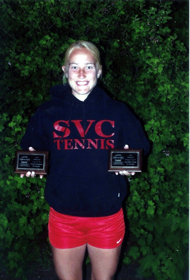 Lindsey Newman holds her two plaques for a singles title and a second-place finish in doubles at the NWAACC tournament.
