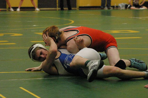 Cameron Schille tries to escape from a pin by Blaine junior Shaypher Hendricks. In the first-round 135-pound match