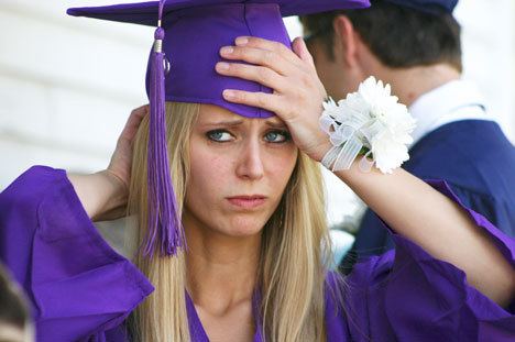 Teran Norton adjusts her cap before the start of commencement for Bayview graduates Thursday.