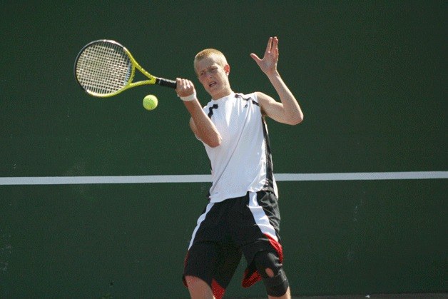 Riley Newman practices in June for the state tennis tournament.