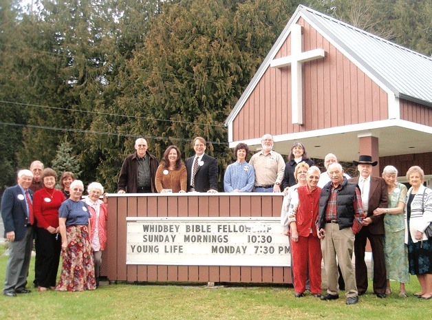 The new congregation gathers outside the Little Brown Church in Maxwelton.