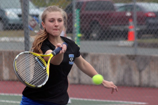 Bayley Gochanour forehands a shot back across the net against King’s in the a doubles match during the 1A District 1 girls tennis tournament semifinals May 14 at South Whidbey High School.