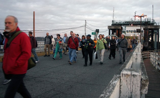 Ben Watanabe / The Record Walk-on passengers disembark the ferry in Mukilteo Tuesday morning. Langley officials are hoping to partner with the Port of South Whidbey in a project that could help increase foot traffic on the boat