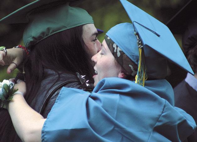 Tamara Wanamaker and Ryan Desrosiers hug in celebration before Bayview School’s graduation on Wednesday.