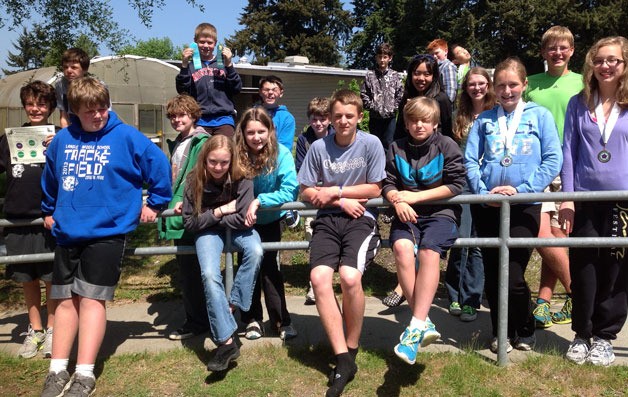 These Langley Middle School math Olympiads brandish their awards after a recent competition. In the front row