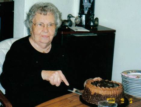 Katherine Taylor cuts her birthday cake nine years ago on her 91st birthday. The former Langley resident turns 100 this month.