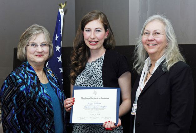 Avery Wilson receives the Good Citizen Award from Cheryl Young and Marcia Statz of the Daughters of the American Revolution on Saturday