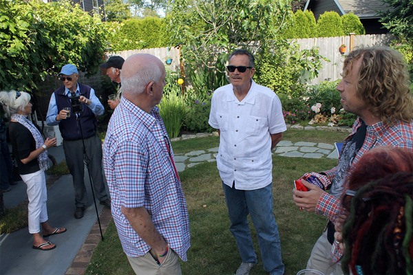 Langley City Councilman Bruce Allen speaks with mayoral hopeful Tim Callison during a campaign kickoff fundraiser last week.