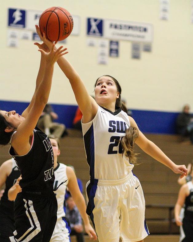 South Whidbey senior Morgan Davis and junior Megan Drake (20) provide both leadership and playing ability to the Falcons’ girls basketball team.