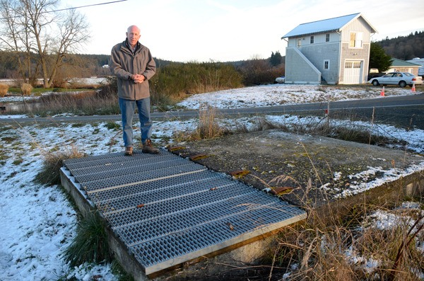 Diking District 2 Commissioner Daryl Vander Pol stands on the tide gate at Maxwelton Beach. Work on the gate