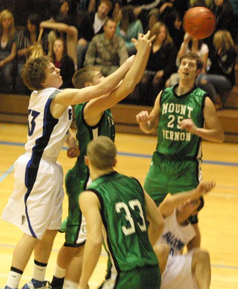 Falcon Shelby Ball attempts the shot as the fourth quarter gets under way Wednesday. South Whidbey lost 71-54 to the 3A Mount Vernon Bulldogs.