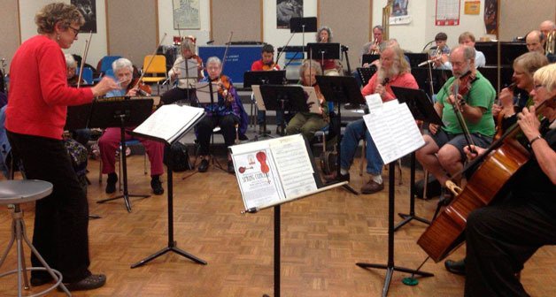 Director Debbie Knight leads a practice session of the Whidbey Orchestra in preparation for its final concert of the season at 7 p.m. Friday