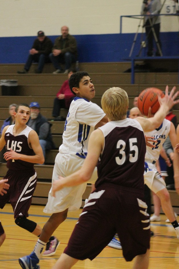 Falcon freshman Lewis Pope drives to the hoop against Lakewood on Tuesday