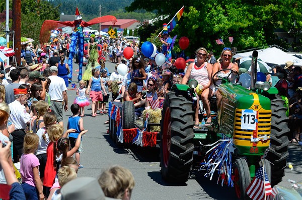 Participants in the 2015 Maxwelton Fourth of July Parade make their way down Maxwelton Road.