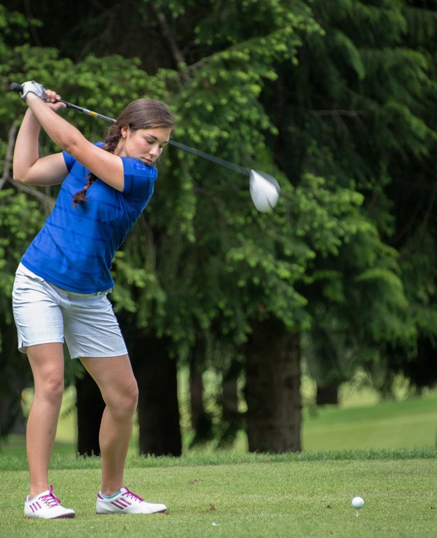 Rosie Portillo takes a practice swing during the 1A tri-district girls golf tournament May 20 at Gold Mountain Golf Course in Bremerton.