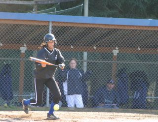 Falcon Allison Wood surprises the pitcher with a bunt taking her to first base during the third inning of the first game of a double header Tuesday against Sultan.