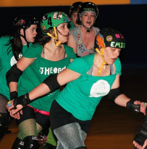 Juliet Janeshefskie (second from left) and Emily Czerwonka (in front) practice with the Jet City Rollergirls at Everett Skate Deck.