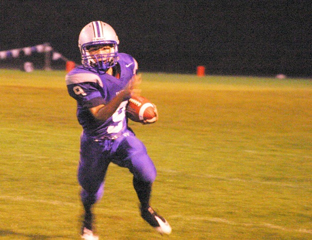 Chris Penafiel runs for a first down on a receiver reverse against Coupeville on Friday