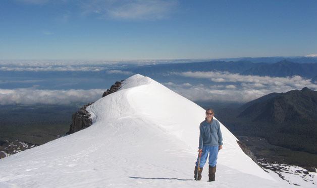 Adventurer and scientist Heather Wright stands on a mountain in Chile. She was recently presented with the George Walker Award