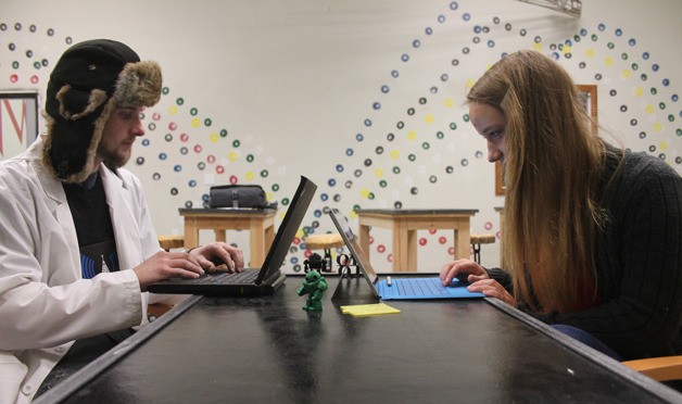 Andy Gilbert of Whidbey Makers and Haley McConnaughey of Atlantis ROV run through computer code tutorials ahead of the Clinton space's participation in the international event