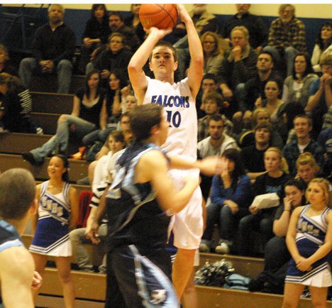 Falcon Cole Erikson rises above the crowd to sink a three-pointer during Tuesday’s 49-45 win over the Sultan Turks. Erikson ended the night with six buckets.