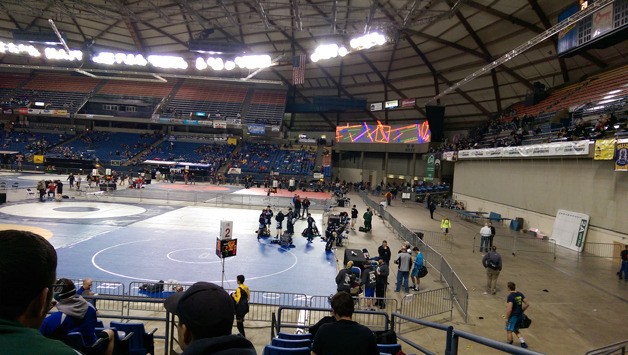 Wrestlers prepare to start the Mat Classic XXVII all-classification wrestling tournament at the Tacoma Dome on Friday